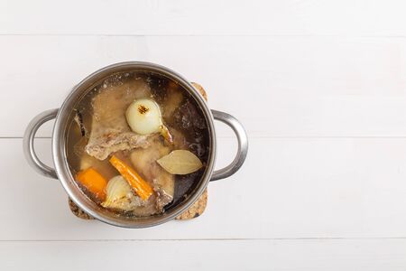 Bone Broth Bouillon in Metal Pan on white backgroundの写真素材