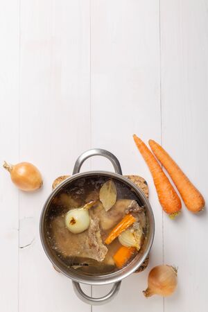Bone Broth Bouillon in Metal Pan on white backgroundの写真素材