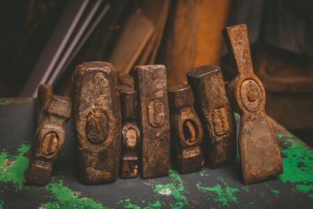 Set of old hammers and rusty nails. tools on old metal the surface. Tonned image , selective focusの写真素材