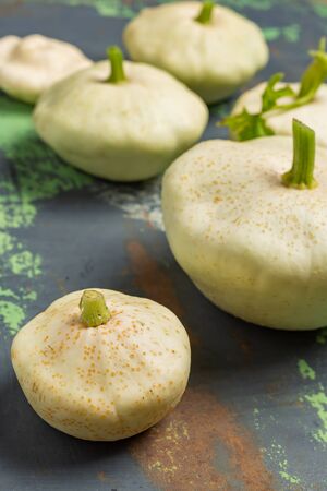 Fresh white squash vegetables on old iron colored background. Selective focusの写真素材