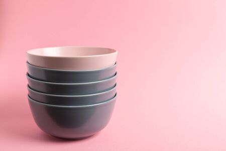 Gray and pink stacked ceramic bowlsの写真素材