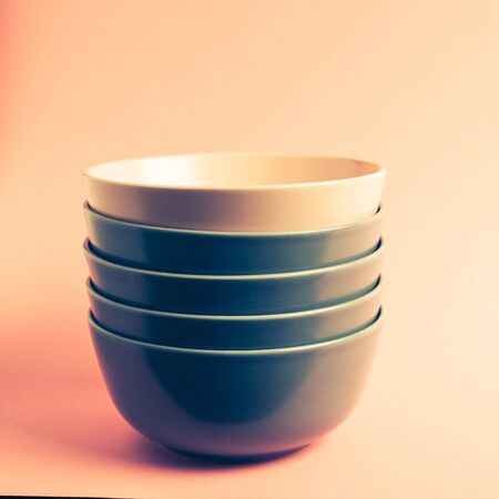 Gray and pink stacked ceramic bowlsの写真素材