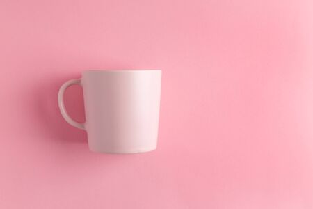Empty pink Mug on pink background with copy spaceの写真素材