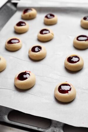Homemade Qurabiya cookie before baking on cooking paper. Selective focusの写真素材