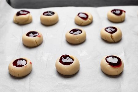 Homemade Qurabiya cookie before baking on cooking paper. Selective focusの写真素材