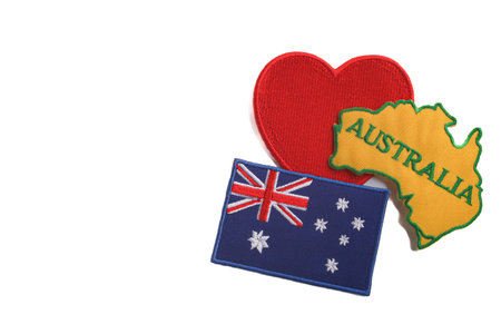 Australia Day concept Embroidered Australia map, red heart, and flag aligned right. White isolated...
