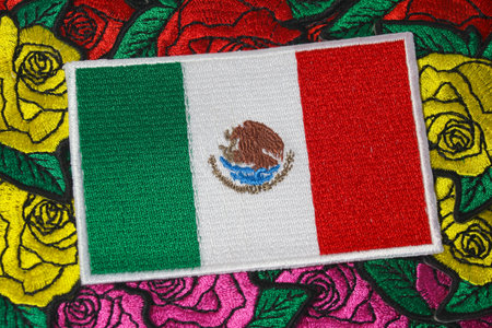 Embroidered Mexican flag on handmade rose embroidery, crafted with colorful thread and fabric. Eco friendly patriotic craft.の写真素材