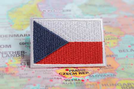 Czech Republic Flag embroidered on map Czechia national flag and CZ flag embroidered on fabric, placed over Prague Czechia map. Symbol of cultural travel and national pride.の写真素材