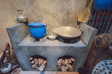 Traditional Thai kitchen with wood fire cooking and clay stoves. A cultural scene rich in aroma, sustainability, and rustic culinary experience.の写真素材
