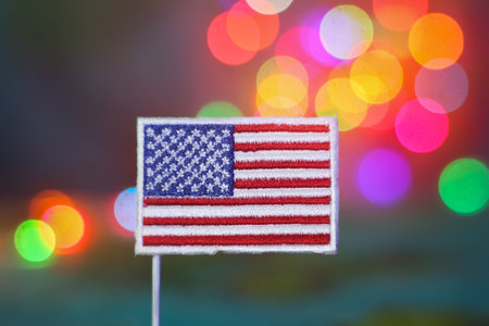 Festive USA flag with colorful bokeh background. Depicts American identity, joyful holidays, and national celebration. Ideal for Independence Day or travel campaigns.の写真素材