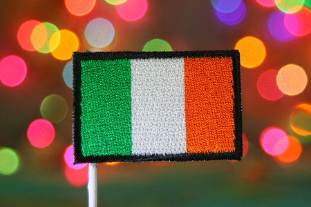 Ireland flag embroidery patch with glowing rainbow bokeh background, symbolizing celebration, Christmas, New Year, independence day, and national pride.の写真素材