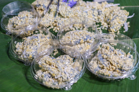 Kanom Tua Paep (Thai Mung Bean Dumpling) with Butterfly Pea color. A colorful and ready-to-eat Thai traditional dessert sold as street food.の写真素材