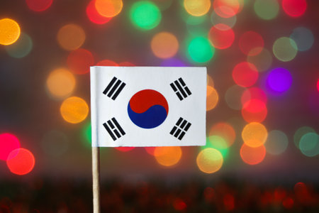 South Korea flag against a vibrant rainbow bokeh background. Represents national day, Christmas, New...