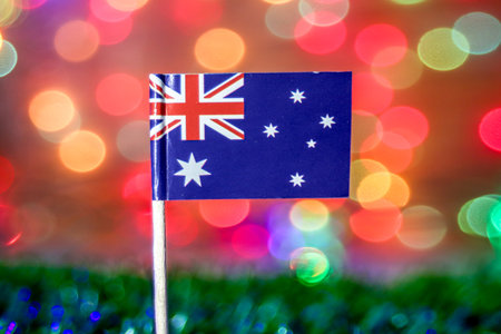 Australia flag with rainbow bokeh background showing joy, travel, and celebration of national festivals like Australia Day and New Year.の写真素材