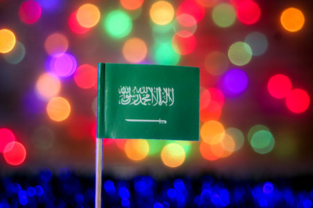 Saudi Arabia flag with bright festive bokeh lights, symbolizing faith, unity, modernization, and national celebration under Vision 2030.の写真素材