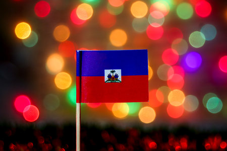 Haitian flag with colorful bokeh lights. Represents freedom, celebration, and Caribbean culture. Great for Independence Day, travel, and cultural unity visuals.の写真素材