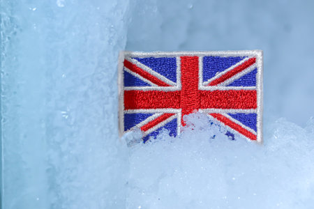 Flag patch in glacial snow, capturing winter landscapes from the Scottish Highlands to Lake District...