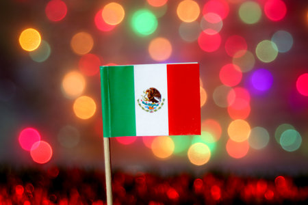 The Mexican flag set against a vibrant bokeh background. Highlighting Independence Day, national pride, and festivals.の写真素材