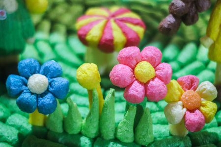 Handmade miniature garden using colored, porous corn puffs. Features vibrant bio-texture and eco-friendly materials. Ideal for sustainable themes and kids' creative activities.の写真素材