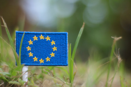 The EU flag in a natural environment. Represents european policy, green earth goals, climate...