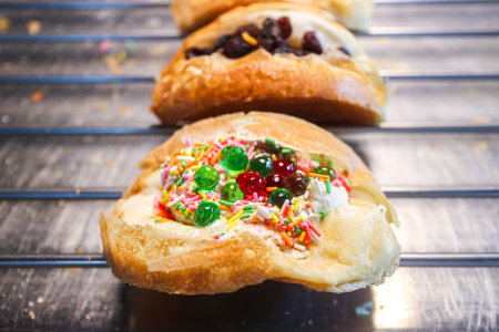 Khanom Thang Taek Thai street pancake with cream and colorful jelly. Authentic Asian sweet snack from local market. High resolution food photography for travel media.の写真素材