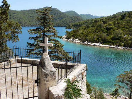 Cross with view on islandsの写真素材