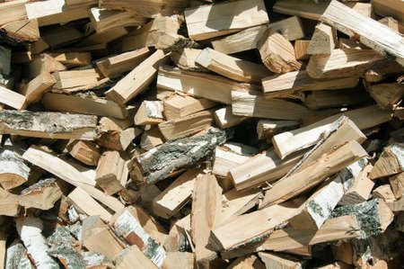 A bunch of ax chopped birch wood, background.の写真素材