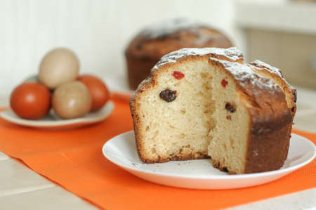 Homemade Easter cake and colored eggs, selective focus, background.