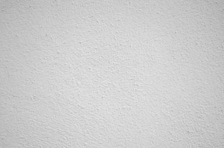 White painted rough wall surface, background.の写真素材