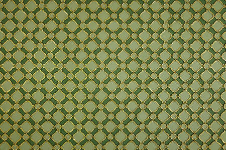 Texture of decorative gold ornament on green wall, background.の写真素材