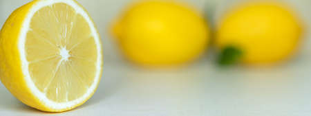 Half a lemon on the kitchen table, shallow depth of field.の写真素材