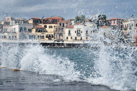 The spray of the waves, the waterfront of Chania, Greece.