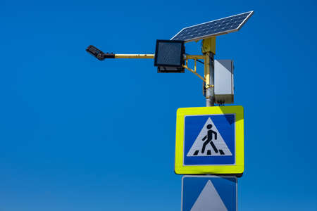 Pedestrian crossing sign with autonomous solar power.