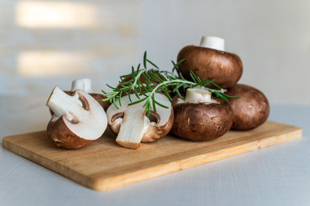 Fresh mushrooms royal champignons on a wooden board.