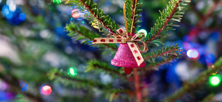Purple bell decoration on the Christmas tree, selective focus.の写真素材
