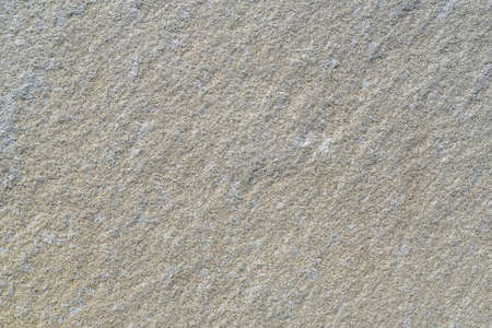 The texture of gray natural granite stone, background.