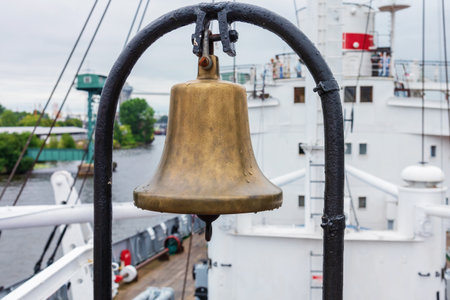Brass ship's bell on board a ship.