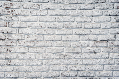 Old painted white brick wall, background.