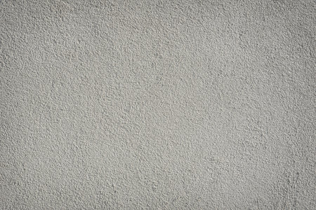 Grainy texture of grey plaster, background.の写真素材