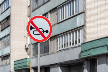 In the park there is a road sign: Sounding the horn is prohibited.の写真素材