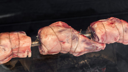 Cooking meat on a spit.の写真素材