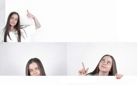 Collage of a beautiful girl with a white sheet of paperの写真素材