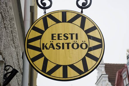 Round wooden sign of Estonian handicraft center in Tallinnのeditorial素材