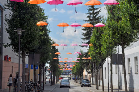 Street view with umbrellas in Barcelona, Spain.の写真素材
