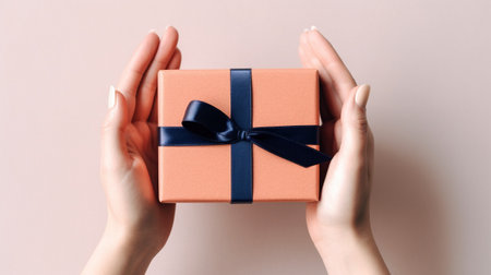 Generative AI, Female hands with natural manicure holding gift box, beige and blue colors background.の素材