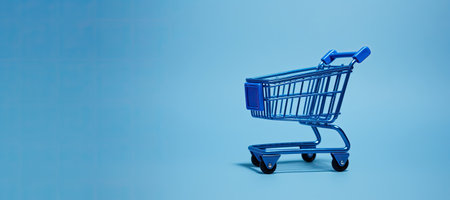 Generative AI, empty shopping cart on blue background, minimalistic shop online, free delivery, discounts and sale concept.の素材