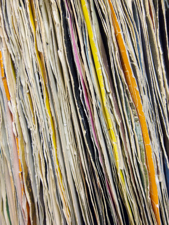 Row of old vinyl records with worn coverの写真素材