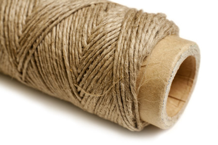 Hemp thread reel, horizontal  Macro studio shot 