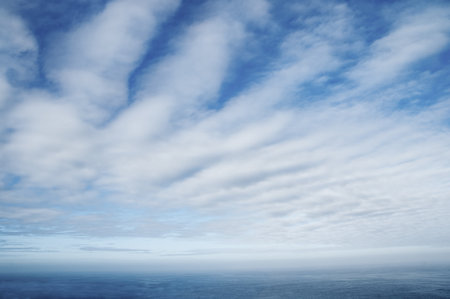 Cumulus cloudscape with deep blue skyの写真素材