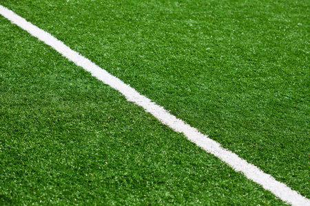 Limit lines of a sports grass field for Background with selective focus